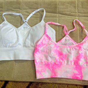 Two yoga/soft sports bras
